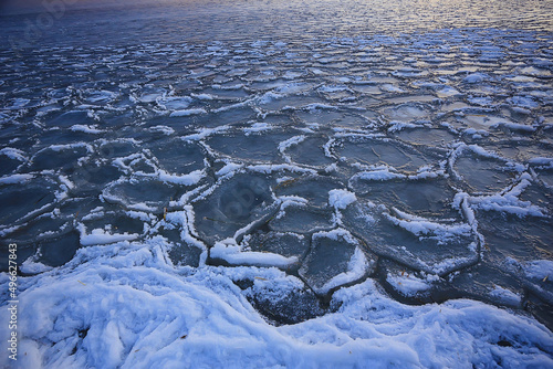 freezing sea ice round pieces  ocean background winter climate coast