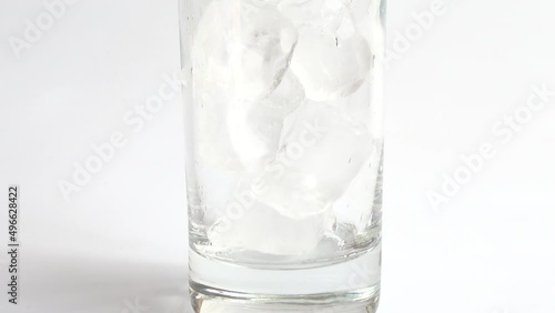 Preparation of coca cola with ice and lemon. photo