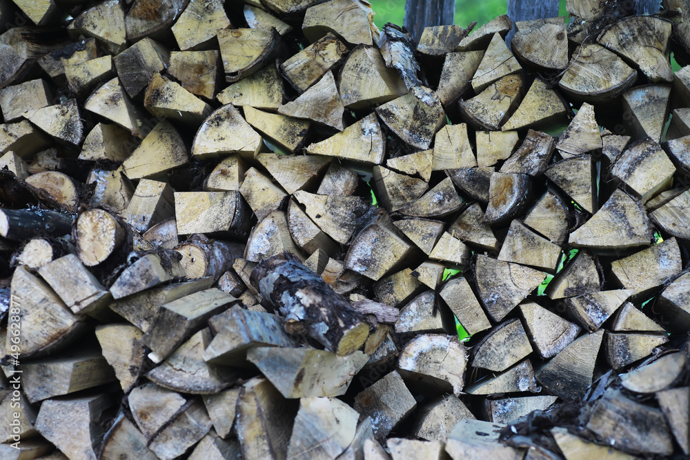 Firewood in a pallet. Chopped firewood lies on the ground. Wooden background.. Firewood in a pallet. Chopped firewood lies on the ground. Wooden background..