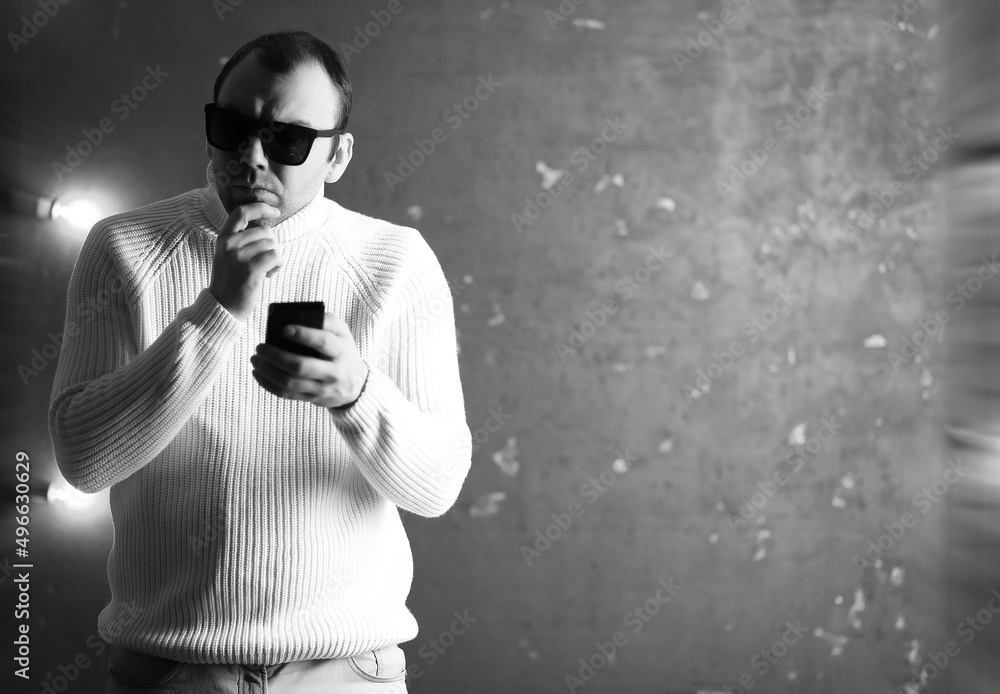 Fototapeta premium A man in a white sweater