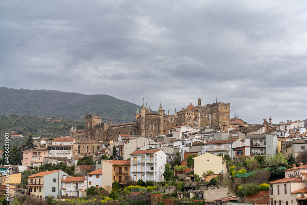 Fototapeta premium landscape view of the village of Guadalupe and the famous monastery and pilgrimage site under an overcast sky