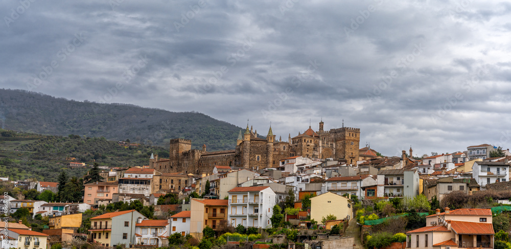 landscape view of the village of Guadalupe and the famous monastery and pilgrimage site under an overcast sky