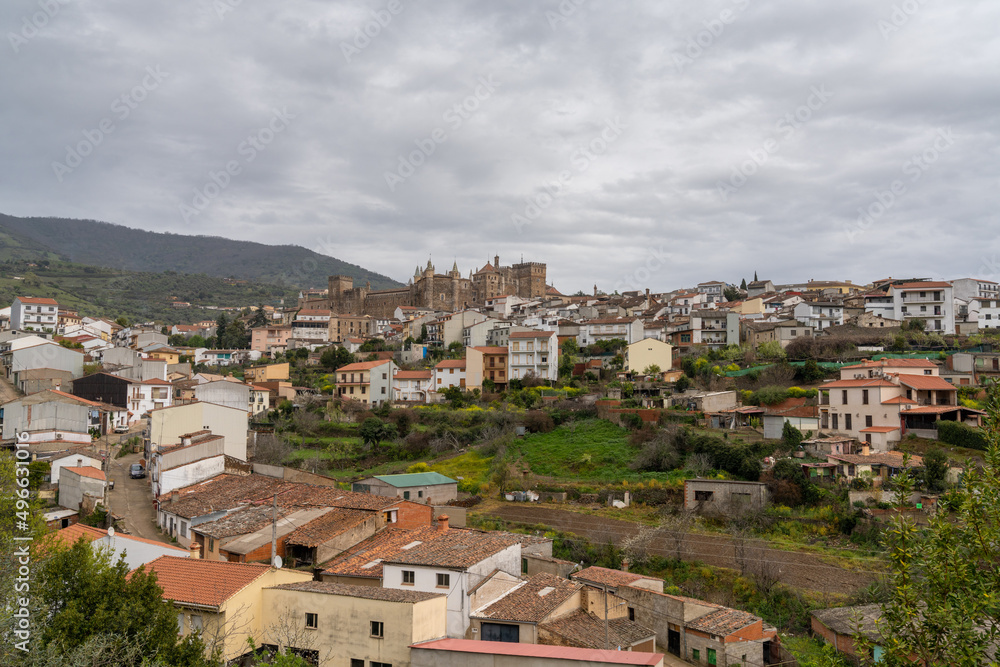 landscape view of the village of Guadalupe and the famous monastery and pilgrimage site under an overcast sky