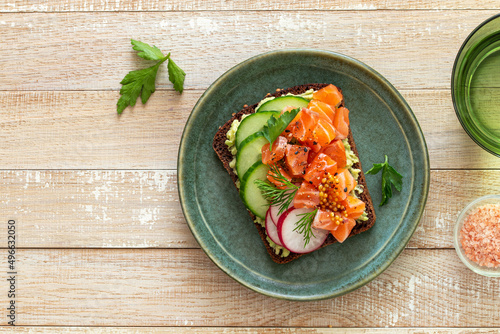 toast with rye bread, salmon, avocado photo