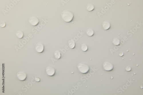 Abstract water drops on grey background  macro  Bubbles close up