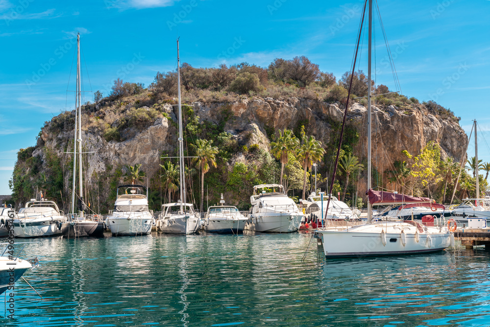Bay area situated in la provincial de Granada. Beautiful harbour with luxury yachts docked in a small bay. All the dock area surrounded by restaurants