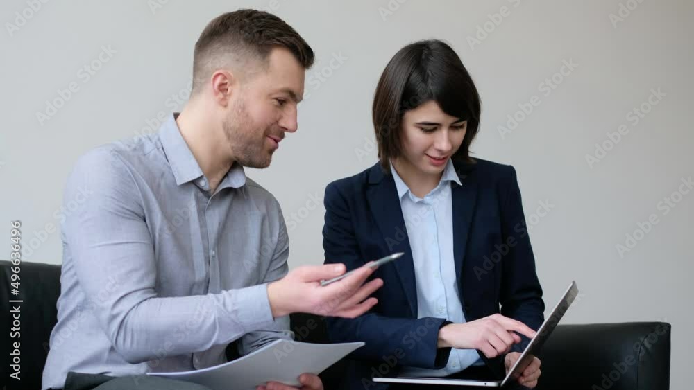 Business people at the office discussing, and working together Business people at the office discussing, and working together