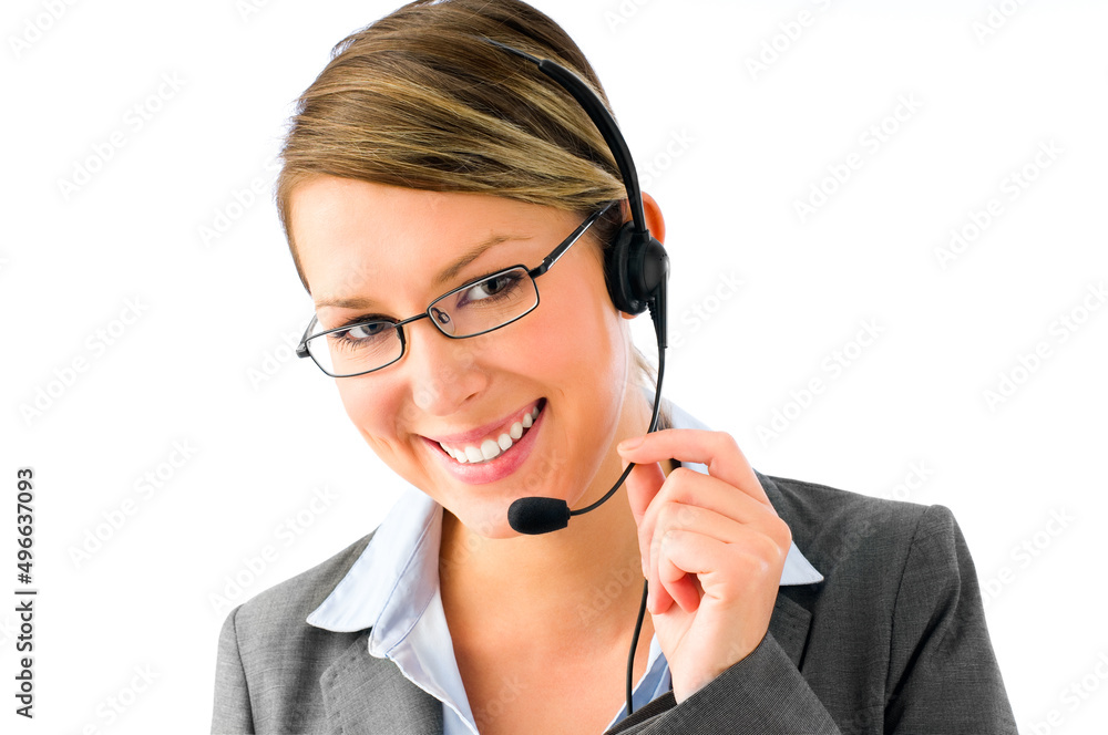 Always here to help. Shot of a businesswoman working in a call center posing against a studio background. Always here to help. Shot of a businesswoman working in a call center posing against a studio background.