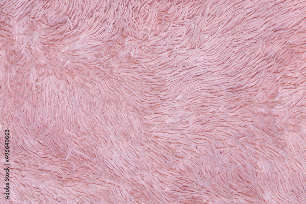 Pink fur texture top view. Abstract wallpaper, textile surface. Coral fluffy fabric coat background. Winter fashion color trends feminine flat lay, female blog backdrop for text signs desidgn. Pink fur texture top view. Abstract wallpaper, textile surface. Coral fluffy fabric coat background. Winter fashion color trends feminine flat lay, female blog backdrop for text signs desidgn.