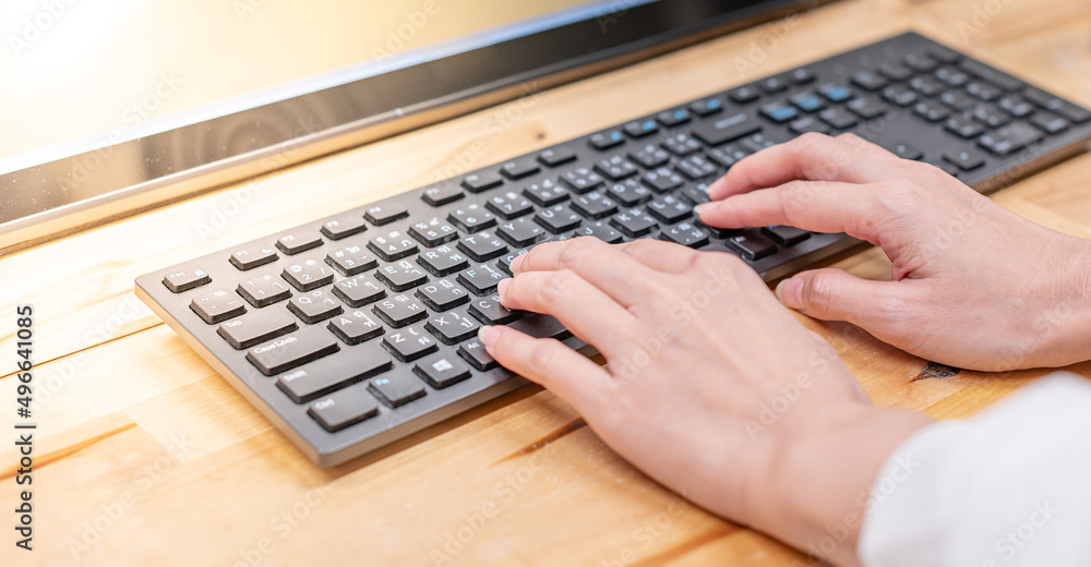Closeup image of hands working and typing on laptop keyboard on the table for the online project incorporate software application, web surfing information online, texting email. Closeup image of hands working and typing on laptop keyboard on the table for the online project incorporate software application, web surfing information online, texting email.