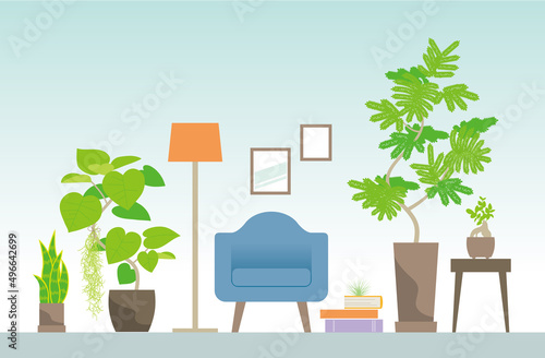 大型の観葉植物とひとりがけソファー、緑に囲まれた部屋のインテリア