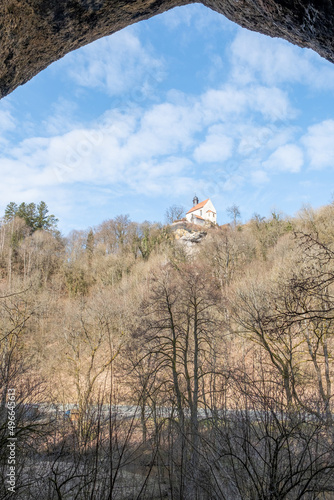 Blick aus der Neumühlhöhle zur Klaussteinkapelle Ahorntal Fränkische Schweiz Oberfranken Bayern photo