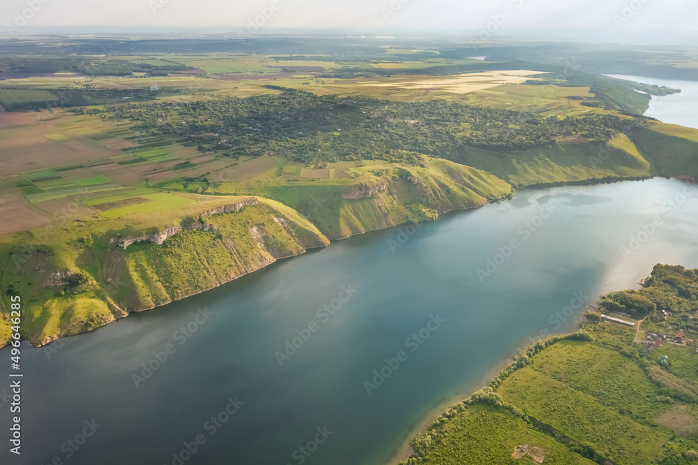 Magnificent aerial view of the Dniester River with picturesque banks. Bakota National Natural Park, Podolskie Tovtry, Ukraine. Beautiful view from a flying drone.