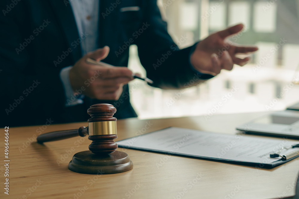 Lawyer's office with judge's hammer and scales, god of justice, legal advisor concept Lawyer's office with judge's hammer and scales, god of justice, legal advisor concept