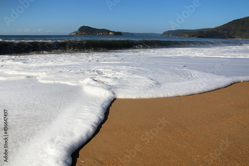 waves on the sand at pearl beach on nsw central coast