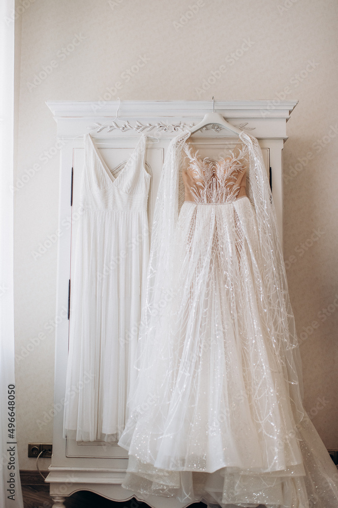 wedding dress hanging on closet door wedding dress hanging on closet door