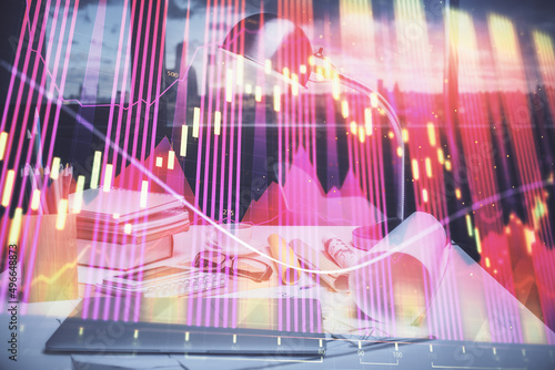 Double exposure of stock market graph drawing and office interior background. Concept of financial analysis. © peshkova