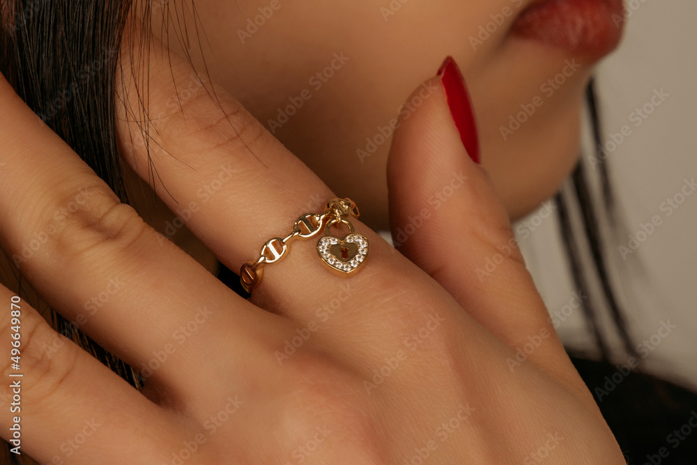 Heart diamond ring, look of a girl wearing beautiful jewelery with precious stones.