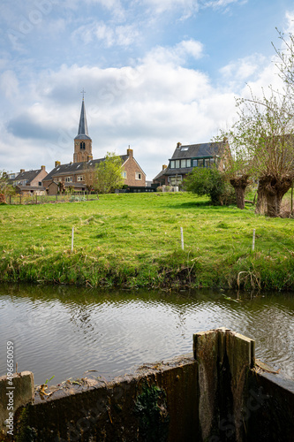 Idyllic view of water-rich landscape and old center on a dike of Nieuwerkerk aan den IJssel, Holland photo