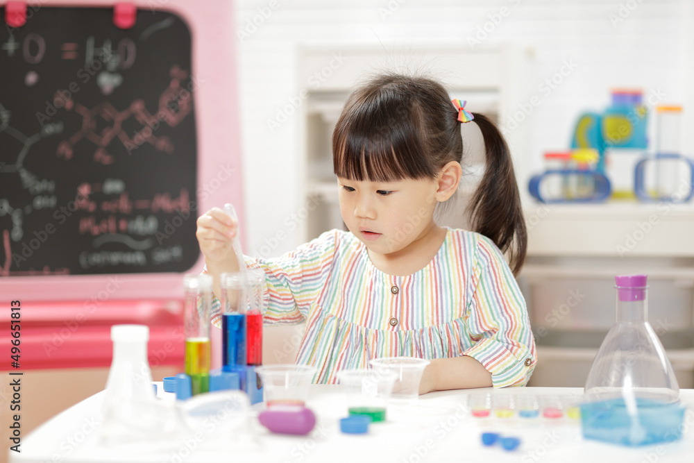 young  girl  play science experiments for home schooling