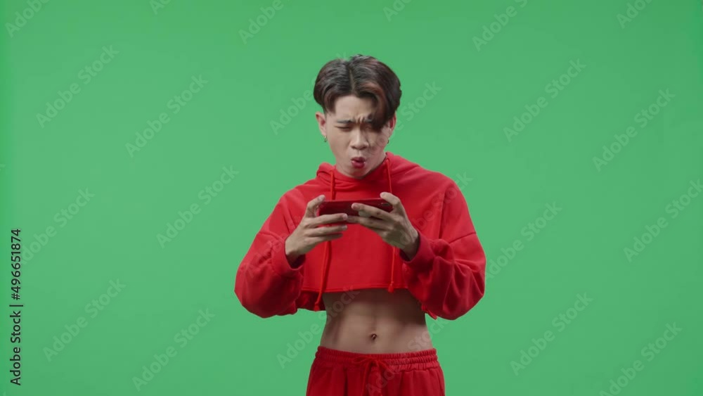 Upset Asian Transgender Male Losing Mobile Phone Game On The Green Screen Background
Upset Asian Transgender Male Losing Mobile Phone Game On The Green Screen Background