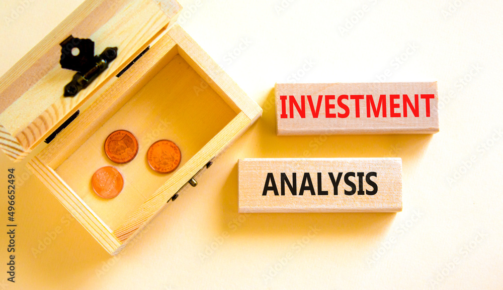 Investment analysis symbol. Wooden blocks with concept words Investment analysis on beautiful white background. Wooden chest with coins. Business investment analysis concept. Copy space. Investment analysis symbol. Wooden blocks with concept words Investment analysis on beautiful white background. Wooden chest with coins. Business investment analysis concept. Copy space.
