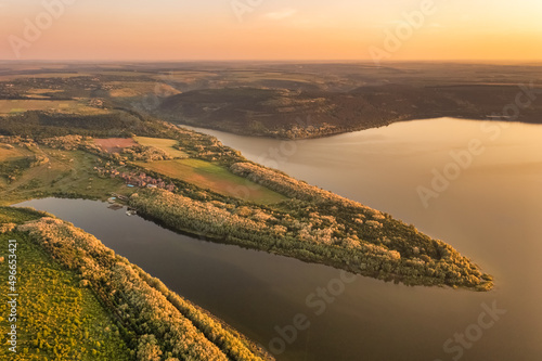 Magnificent aerial view of the Dniester River with picturesque banks during dawn. Bakota National Natural Park, Podolskie Tovtry, Ukraine. Beautiful view from a flying drone. photo