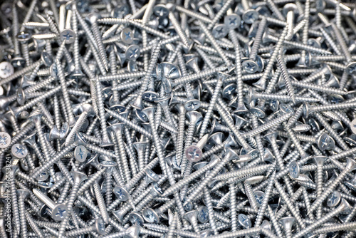 Self-tapping screws in a store, selective focus. Background for construction industry