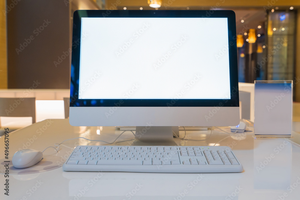 Fototapeta premium computer desktop with keyboard, diary and other accessories on table in cafe