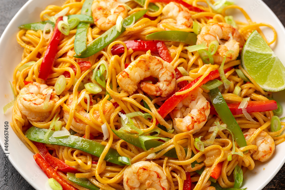 Stir fry noodles with prawns and vegetables in white plate. Healthy asian food Stir fry noodles with prawns and vegetables in white plate. Healthy asian food