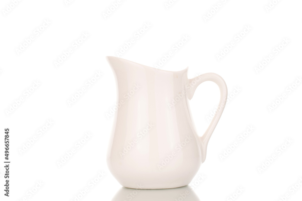 One ceramic milk jug, close-up, isolated on a white background. One ceramic milk jug, close-up, isolated on a white background.