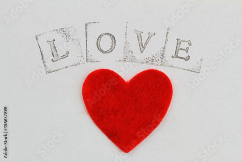 Obraz na płótnie Word love made with letter stamps and big red heart on white background
w salonie