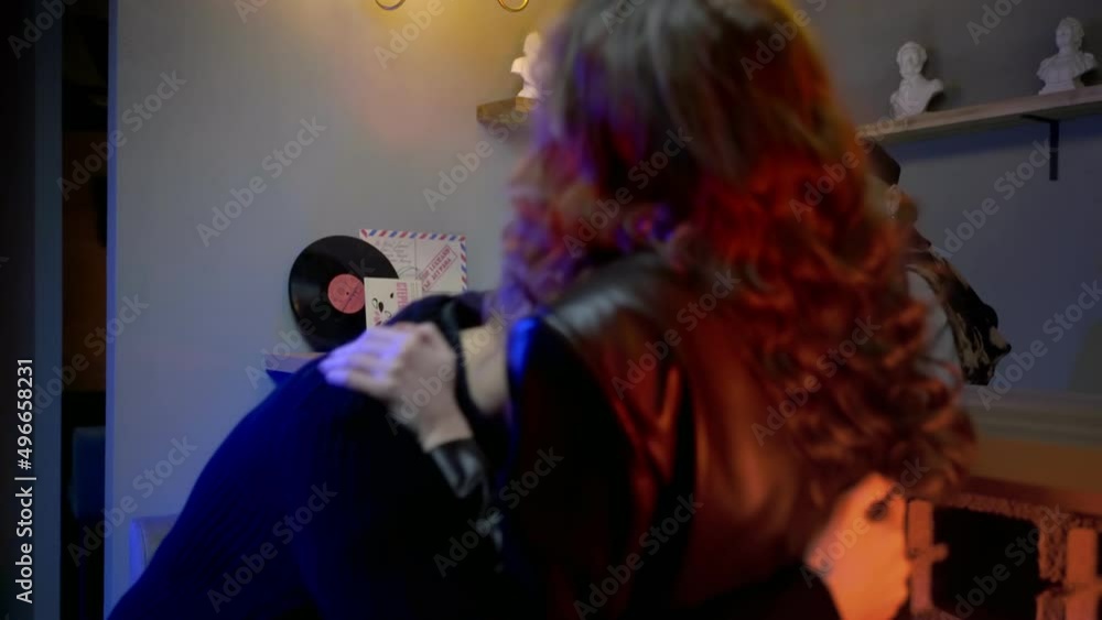 A young couple meets in a nightclub bar. A girl takes a drunk guy off the bar. The couple drinks alcohol. Night club A young couple meets in a nightclub bar. A girl takes a drunk guy off the bar. The couple drinks alcohol. Night club