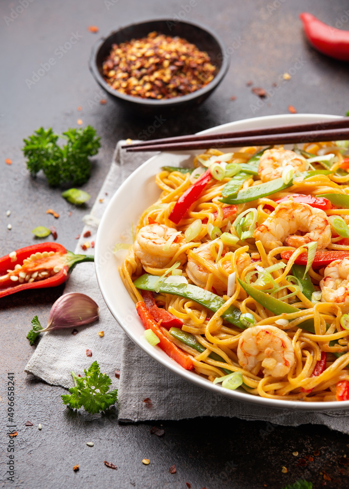 Stir fry noodles with prawns and vegetables in white plate. Healthy asian food Stir fry noodles with prawns and vegetables in white plate. Healthy asian food