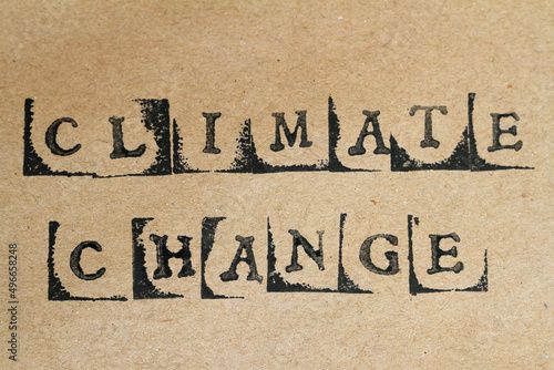 Obraz na płótnie Word climate change made with letter stamps on grey hand made paper
w salonie