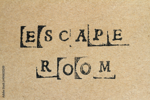 Word escape room made with letter stamps on grey hand made paper
