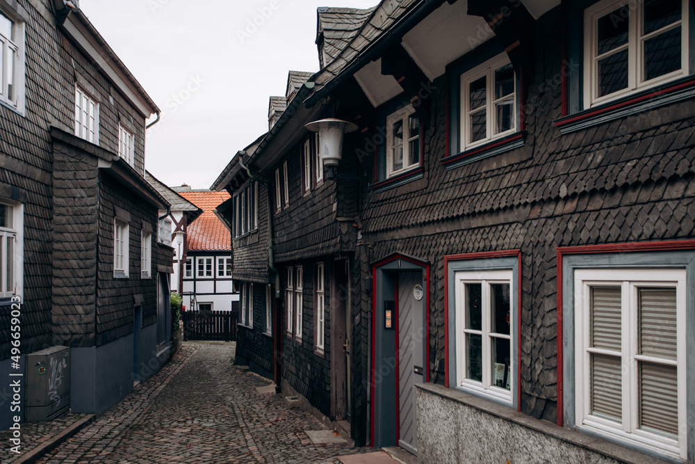 View on timbered houses and cobbled street in the historic old town of Goslar, Germany View on timbered houses and cobbled street in the historic old town of Goslar, Germany