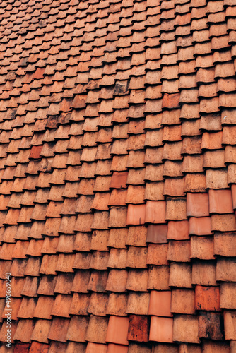 The texture of the roof of the roof  made of shingles. The texture of shingles. Background 