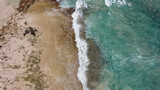 Corralejo, Spain - 3 January, 2022: Beautiful  Corralejo beach with dunes, kitesurfing and turquoise water