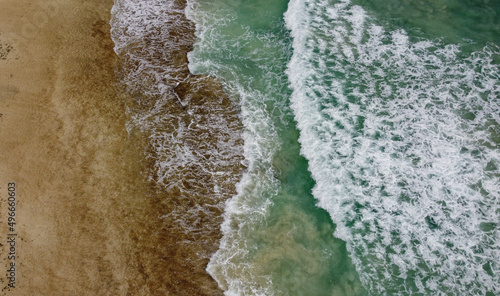 Corralejo, Spain - 3 January, 2022: Beautiful Corralejo beach with dunes, kitesurfing and turquoise water