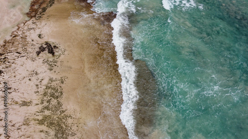 Corralejo, Spain - 3 January, 2022: Beautiful Corralejo beach with dunes, kitesurfing and turquoise water