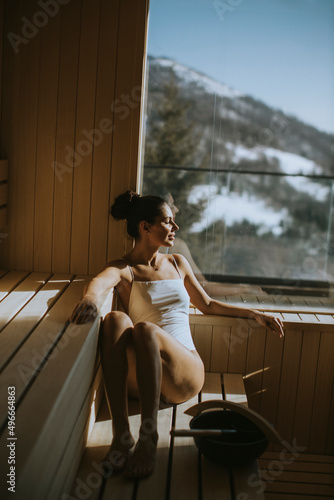 Young woman relaxing in the sauna