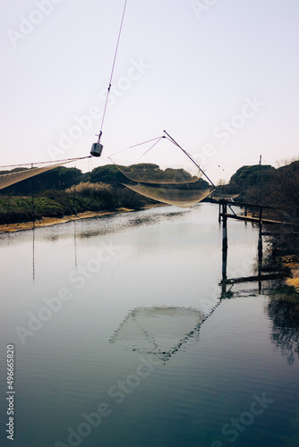 Wallpaper Mural Comacchio fishing valleys. Fishing nets suspended over a canal. Vertical image. Torontodigital.ca