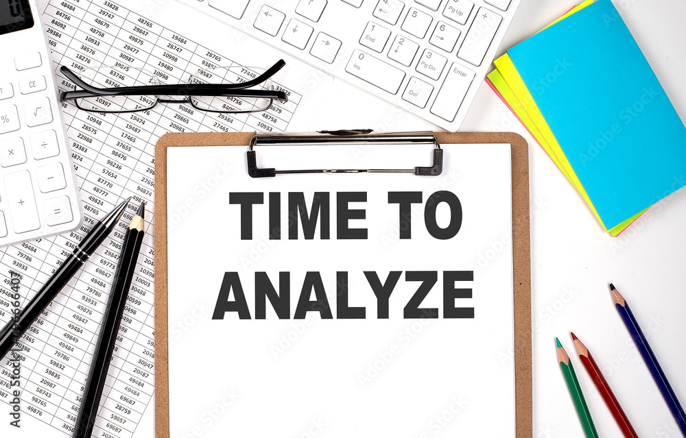 Clipboard with text TIME TO ANALYZE keyboard and chart on white background. Clipboard with text TIME TO ANALYZE keyboard and chart on white background.