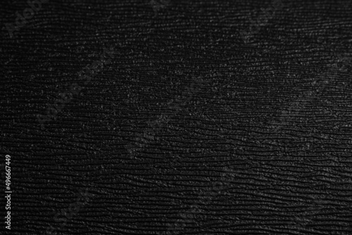 Black coarse texture. Black plastic background