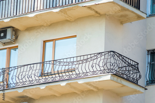 a metal fence on the balcony of a historic building