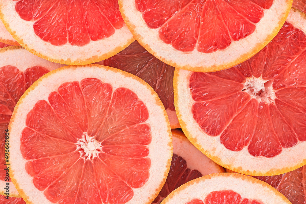 Food background - Texture of a ripe grapefruit slices, closeup. Grapefruit background. Food background - Texture of a ripe grapefruit slices, closeup. Grapefruit background.