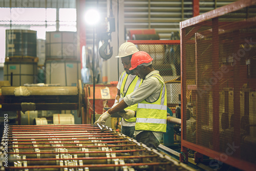 Black worker, Engineer team working together in metal factory heavy industry