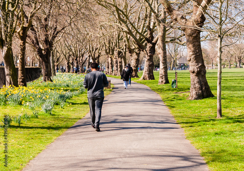 Canvas Print London, United Kingdom, 22 March 2022: People exercising in Central Park, regula