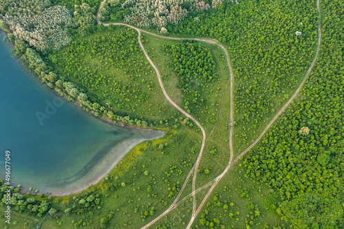 Magnificent aerial view of the Dniester River with picturesque banks during dawn. Bakota National Natural Park, Podolskie Tovtry, Ukraine. Beautiful view from a flying drone.